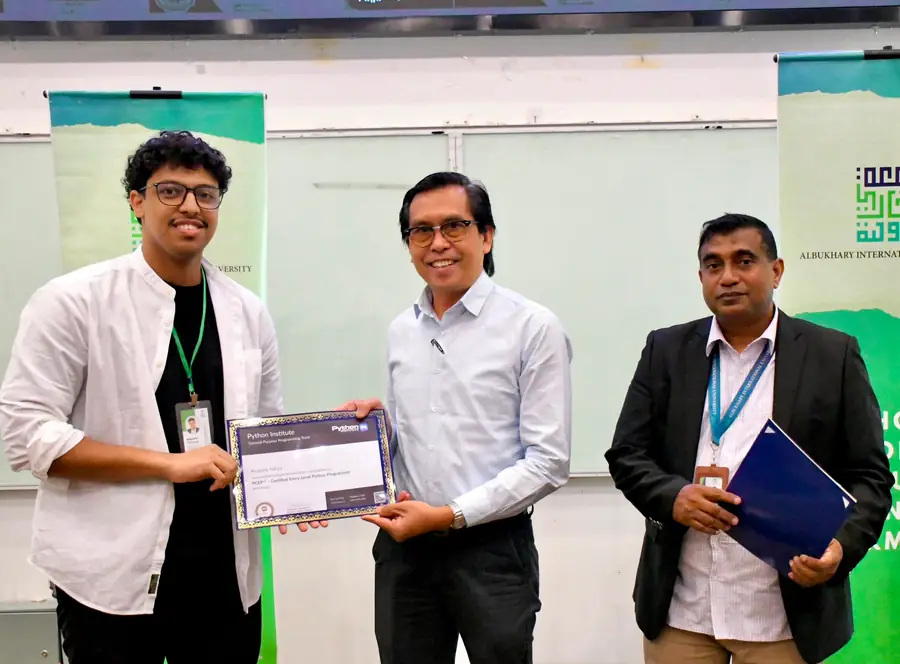 Being handed a certificate at a university ceremony.