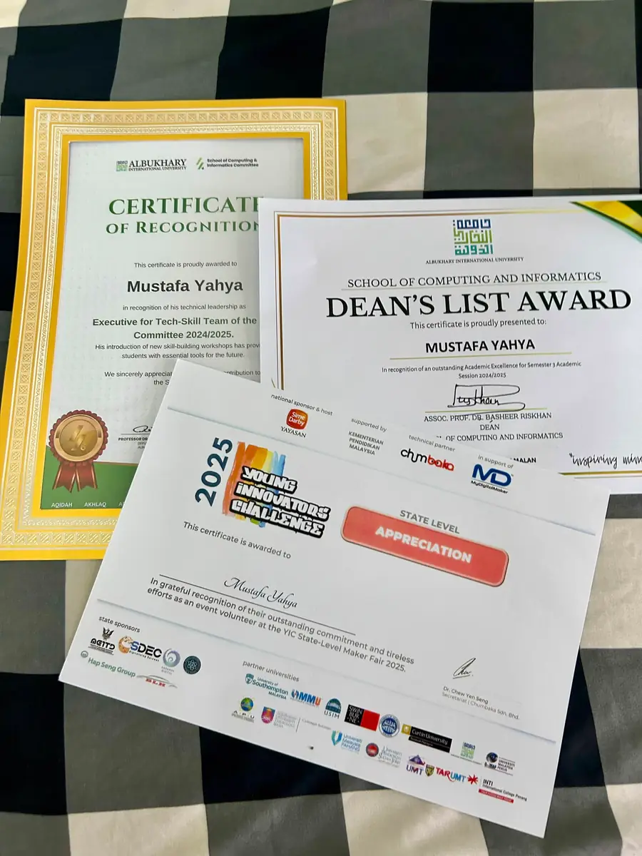 A Dean's List award certificate alongside two certificates of recognition.